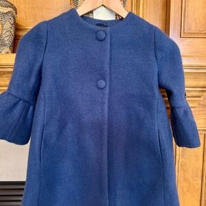 Monnalisa girls single breasted wool coat with polka dots as lining. Size 5.